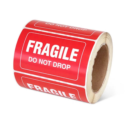 Photograph of a roll of Speciality Handling Labels, "Fragile, Do Not Drop" .