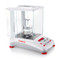 Photograph of Ohaus Adventurer™ Semi-Micro Balance with density determination kit in use (not included).
