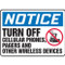 Photograph of a an OSHA sign that reads: NOTICE (in white lettering on blue banner) TURN OFF CELLULAR PHONES,PAGERS AND OTHER WIRELESS DEVICES (in black lettering on white background).  There is a graphic of a cell phone in a red circle with a red line through it on the right side of the sign.