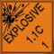 An orange and black photograph of a 03062 dot explosives shipping label, reading explosives 1.1C 1 with graphic.