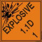 An orange and black photograph of a 03062 dot explosives shipping label, reading explosives 1.1D 1 with graphic.