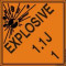 An orange and black photograph of a 03062 dot explosives shipping label, reading explosives 1.1J 1 with graphic.
