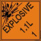 An orange and black photograph of a 03062 dot explosives shipping label, reading explosives 1.1L 1 with graphic.