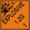An orange and black photograph of a 03063 dot explosives shipping label, reading explosives 1.2G 1 with graphic.