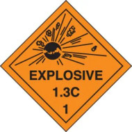 An orange and black photograph of a 03064 dot explosives shipping label, reading explosives 1.3C 1 with graphic.