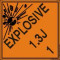 An orange and black photograph of a 03064 dot explosives shipping label, reading explosives 1.3J 1 with graphic.