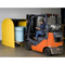 Photograph of a 4-Drum DrumShed being loaded with a pallet of drums using a forklift.