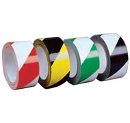 A photograph of a four rolls of striped hazard warning laminated tape. From left to right: red/white, yellow/black, green/white, black/white.