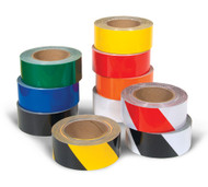 A photograph of a multiple rolls of 06405 Tuffmark ultra durable floor marking tape in various colors.
