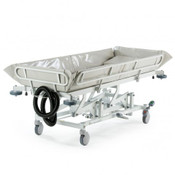 Shower Trolley Hydraulic Adult features a foam padded PVC liner, central locking & steering, side rails, Electric models are supplied with 2 rechargeable batteries, 4-6 week lead time.