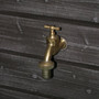 Close up of the Brass Tap and Wooden Board Effect.