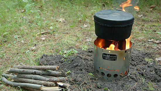 wood burning camp stove with sticks and twigs