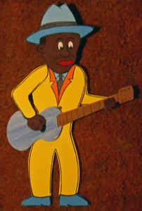Cut-out Bluesman Playing Guitar by George Borum