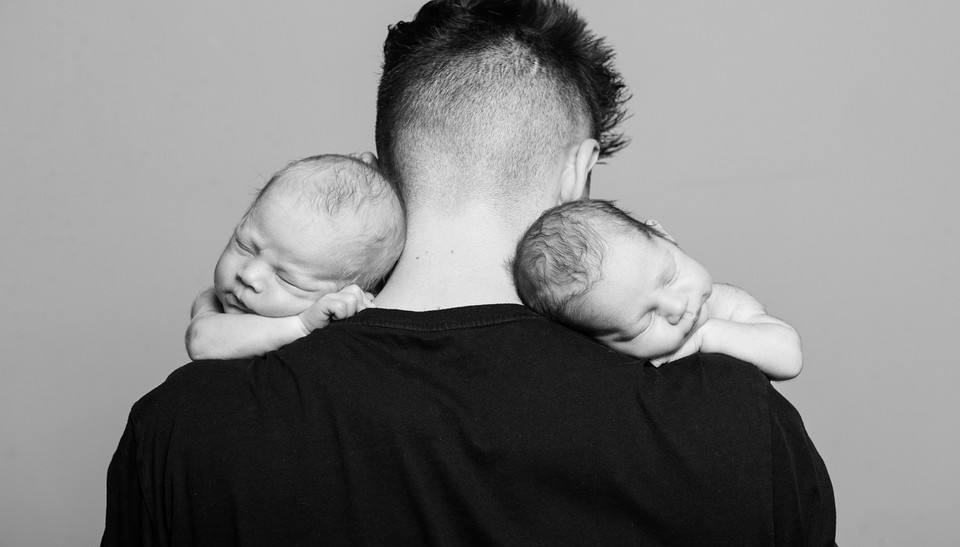 studio portrait photograph of newborn twin babies