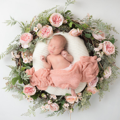 Beautiful newborn photograph of baby in floral wreath. By Emotion Studios photography Shropshire
