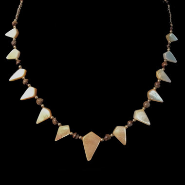 Handmade necklace with shell and tiger eye beads.