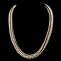 Hand beaded Swarovski gold pearls on black seed beads; fits all sizes. 