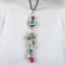 Long Necklace with Blue and Fuchsia Charms and Tassel