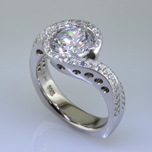 When it’s time for an upgrade, this diamond engagement ring is an elegant choice. Classic lines with a modern feel, combining a half carat of pavé set Ideal cut Diamonds with the center stone of your choice (sold seperately).

This diamond engagement ring is priced in 14k gold, and can be made in any karat or color of gold, and in platinum. Makes a great anniversary gift for 20, 30 or more years together. 

This custom designed engagement ring is individually crafted to be Perfectly You, and takes about 3-5 weeks to create. Call us for more information about how we can customize this design Just For You. Designed, and created in our studio by the artist Stuart J.

Designed and handmade by the artist Stuart J.