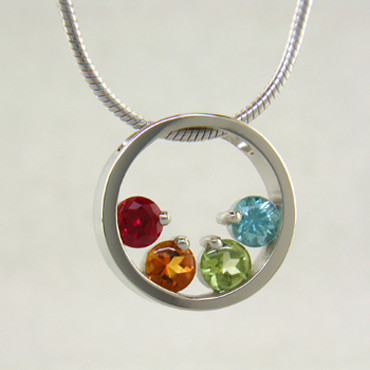 If you are looking for an elegant, classy birthstone pendant, you found it! Available for up to 6 gemstones, in 14 karat Yellow or White Gold, and it comes with a 1mm 16 inch snake chain. We use only genuine and lab created birthstones. Unless otherwise requested, stones will always be centered at the bottom of the circle. If you would like different stone options, such as genuine Emerald, Ruby, or Sapphire, please call or email us. We can make this any way you'd like, and in most metals.

Please let us know how you would like yours, if different from the options listed here. This is a Special Order item (see Policy information for details), and ships in approximately 2 weeks.

Designed, and created in our studio by the artist Stuart J.