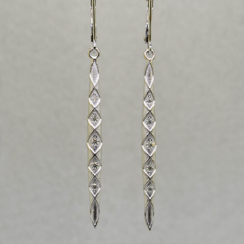 You will feel like a Princess wearing these striking, long dangling diamond earrings. Set with .20ct. T.W. of Ideal cut Diamonds, in 14 karat Brilliant White Gold, dangling from lever backs. Earrings measure 2 1/4 inches long.

Designed, and created in our studio by the artist Stuart J.
