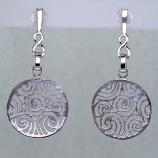 Light, airy, and easy to wear, these rhodium plated Sterling Silver earrings are just what you need when comfort and style are the order of the day. With a subtle textured finish, and clean modern filigree design, they are unobtrusive, and complimentory to any outfit. They dangle on posts, and measure 3/4 inch.

Handcrafted in Northern Spain.