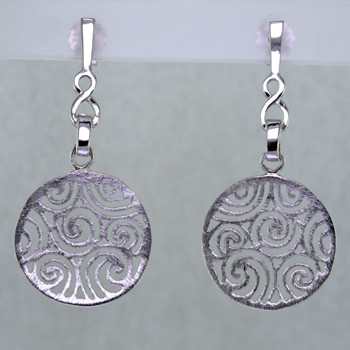 Light, airy, and easy to wear, these rhodium plated Sterling Silver earrings are just what you need when comfort and style are the order of the day. With a subtle textured finish, and clean modern filigree design, they are unobtrusive, and complimentory to any outfit. They dangle on posts, and measure 3/4 inch.

Handcrafted in Northern Spain.