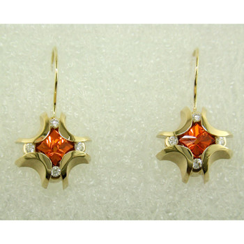 xceptionally lovely 14 karat Yellow Gold custom made Garnet earrings. Set with 2.62cts. of fine Mandarin Garnet flower cut gemstones, custom cut for us by the famed stone cutters in Idar-Oberstein, Germany.  

Acented with .26ct. T.W. of Ideal cut Diamonds, and dangling on wires. Measure 1 inch long.

Designed, and created in our studio by the artist Stuart J.