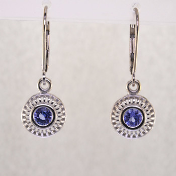 Blending traditional and modern design, these earrings dazzle, day or night. Handcrafted in 14 karat White Gold with sparkling 4mm Tanzanite gemstones, dangling on lever backs. Earrings measure 1 inch long.  

Designed, and created in our studio by the artist Stuart J.