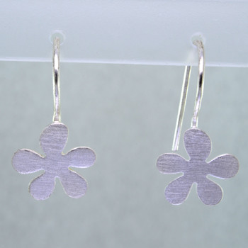 Sweet flower earrings in sterling silver hanging on wires. Measures  3/4" long.  Hand crafted in Istanbul.