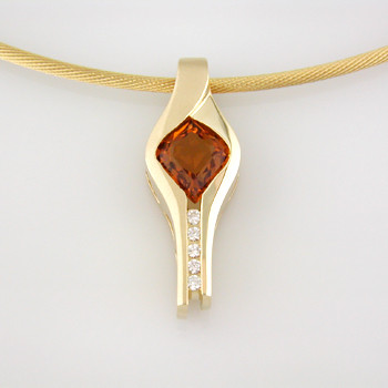 Warm and glowing, this pendant is a one-of-a-kind dazzler. 14 karat Yellow Gold surrounds this 1.55ct. custom cut onion shape Citrine, from the renowned gem cutting artists of Idar-Oberstein, Germany. Accented with .08ct. T.W. of Ideal cut Diamonds. Includes a 14 karat Yellow Gold oval link chain, 18 inches long.

Designed, and created in our studio by the artist Stuart J.