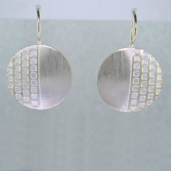 Fun for everyday, these earrings will be your go-to accessory. Modern geometric circles in Sterling Silver, dangling from wires. Measure 3/4 inch long.

Handmade in Istanbul, Turkey.