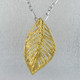 Everyday casual, or evening chic, you can't go wrong with this gold plated Sterling Silver leaf pendant. Includes the Sterling Silver 1.6mm snake chain, 18 inches long. The pendant measures 2 inches long.

Hand-crafted in Northern Spain. 