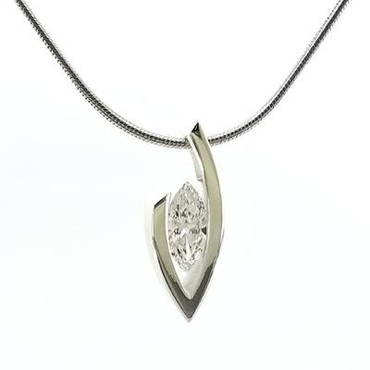 This elegant and timeless Diamond pendant will never go out of style. This one is 14 karat White Gold with a spectacular .51ct. Lab grown Marquise cut Diamond (H vs2 Quality). The Diamond appears to be floating, creating a classic look. Includes a 14 karat 1.2mm White Gold snake chain, 16"long. Measures 3/4 inch long.

We can also make this design for any size diamond or gemstone. Wondering what to do with that diamond in your drawer? Wonder no more!  Please allow 2- 3 weeks for delivery.

Designed, and created in our studio by the artist Stuart J.