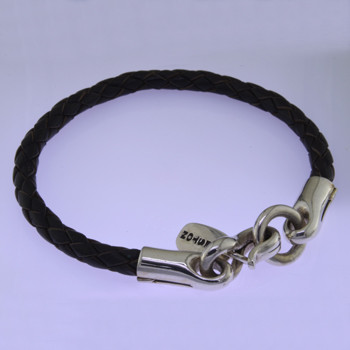 Modern but classic, this leather and Sterling Silver bracelet is perfect for everyday wear. Dark brown leather with a bold Sterling Silver clasp. Uniquely designed for men or women. 1/4 inch thick and 8 inches long. Can be sized smaller only. Available in other colors. Call or email for other options.

by David Heston of San Rafael, California.