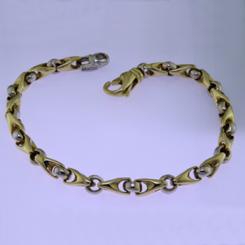 This beautiful open link two tone bracelet has an elegant, luxurious feel. Handcrafted in solid 14 karat yellow and white gold. Measures 7.5 inches long, and can be orderd in any size, or karat and color of gold, and platinum. How's that for options. This one, however, is ready for a wrist now.

Proudly crafted in the U.S.A.
