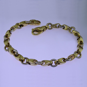 This beautiful open link two tone bracelet has an elegant, luxurious feel. Handcrafted in solid 14 karat yellow and white gold. Measures 7.5 inches long, and can be orderd in any size, or karat and color of gold, and platinum. How's that for options. This one, however, is ready for a wrist now.

Proudly crafted in the U.S.A.