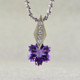 This Amethyst snowflake and Diamond Piercette® pendant will melt your heart. Set in 14 karat white gold, with an 8mm custom cut deep purple Amethyst snowflake, dangling from a kite shaped bail, sprinkled with .05ct. T.W. Ideal cut Diamonds.
The Amethyst snowflake gemstone is custom cut, exclusively for us, in Canada. Includes a 14 karat white gold 1.3mm diamond cut wheat chain, 18 inches long. Pendant measures 5/8" long.
Designed and handmade by the artist Stuart J.

A Piercette® is a patented method of setting, with a gemstone that moves. The gem is set so that it swivels with every movement of the wearer, exhibiting extra sparkle. 