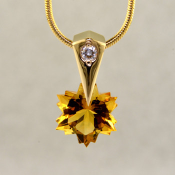 The hottest snowflake around! Custom cut, exclusively for us, in Canada. Dangling from a 14 karat yellow gold Piercette® pendant, with a perfectly cut sparkling 8mm Citrine snowflake cut gemstone, and accented with a single .03ct. Ideal cut Diamond. Includes a 14k yellow gold 1mm diameter, smooth snake chain, 16 inches long. Measures 1/2 inch long.

Designed and handmade by the artist Stuart J.

A Piercette® is a patented method of setting, with a gemstone that moves. The gem is set so that it swivels with every movement of the wearer, exhibiting extra sparkle. 