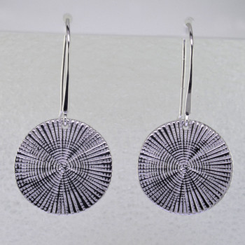 Beautiful spiral earrings in rhodium plated sterling silver. Dangling on wires, these stylish earrings measure 1 1/2 inches long.

Handmade in northern Spain.