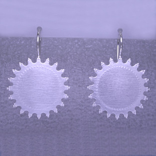 Playful and bright, these sunburst earrings are a delight to wear and they will make you smile. Crafted in Sterling Silver with a sunburst pattern, hanging on wires, and measuring 1 1/4 inches long. 

Handmade in Istanbul, Turkey.