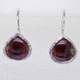 Simple, sophisticated single tear drop Amethyst earrings in rhodium plated Sterling Silver, with 12x14mm deep red Garnet cabachon pear shapes, hanging on wires. Measuring 1 1/4 inches long.

Handcrafted in northern Spain.