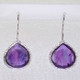 Simple, sophisticated single tear drop Amethyst earrings in rhodium plated Sterling Silver, with 12x14mm purple Amethyst cabachon pear shapes, hanging on wires. Measuring 1 1/4 inches long.

Handcrafted in northern Spain.