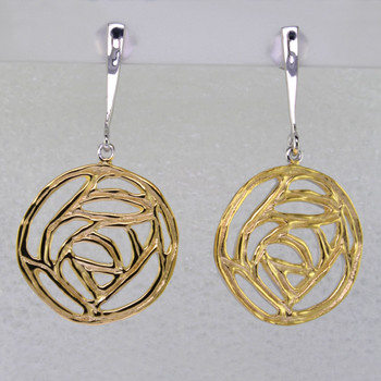 Easy, fun earrings you can wear anywhere. These earrings feel a little bit vintage, but a little bit modern too. Gold plated Sterling Silver, these earrings hang on dangle posts. Measure 1 3/4 inches long.

Handcrafted in northern Spain.