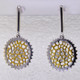 These earrings are sure to make you feel good. Edgy and modern circles in rhodium and gold plated Sterling Silver. Hanging on dangle posts, these earrings measure 1 1/2 inches long.

Handcrafted in northern Spain.