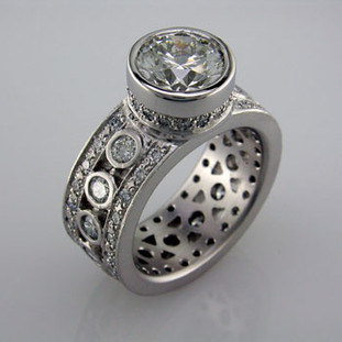 With this spectacular engagement ring on your finger, you will feel like royalty, and be the envy of all of your friends. With almost 2 carats of Ideal cut diamonds, Sparkle is this rings middle name. There are no prongs to catch, and it is very comfortable to wear. Made for a 2.5 carat center diamond or gemstone (sold seperately), this custom designed engagement ring is individually crafted to be Perfectly You, and takes about 3-5 weeks to create. Call us for more information about how we can customize this design Just For You. Designed, and created in our studio by the artist Stuart J.

This diamond engagement ring is priced in 14k gold, and can be made in any karat or color, and in platinum. Makes a great anniversary gift for 20, 30 or more years together.