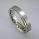 Sleek man's wedding band, 5mm wide, comfort fit, in 14 karat White Gold with a soft matte finish and a shiny edge. For the sophisticated man.

This is a special order item; please call with finger size, and allow two weeks for us to make it. It will be worth it!

Designed, and created in our studio by the artist Stuart J.