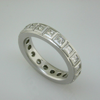 Modern and classic, this princess cut diamond anniversary ring will never go out of style. Wear it as a stacking or single ring, an anniversary ring, or a wedding ring. We can make it in any karat or color of gold, and platinum.

This custom designed anniversary ring is individually crafted to be Perfectly You, and takes about 3-5 weeks to create. Call us for more information about how we can customize this design Just For You. Designed, and created in our studio by the artist Stuart J.