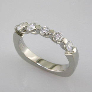 A contemporary diamond anniversary ring that is great on it's own, or stacked with other rings. Can even be worn as an engagement ring. Set with .50ct. T.W. of ideal cut diamonds, or you can also alternate the diamonds with gemstones to change it up. We can customize this ring any way you wish.

This diamond anniversary ring is priced in 14k gold, and can be made in any karat or color of gold, and in platinum. Makes a great anniversary gift for 20, 30 or more years together.

This custom designed anniversary/engagement ring is individually crafted to be Perfectly You, and takes about 2 weeks to create. Please let us know if you need it sooner. Call us for more information about how we can customize this design Just For You. Designed, and created in our studio by the artist Stuart J.