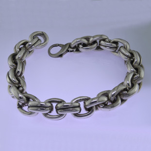 Go bold with this stylish oval link Sterling Silver bracelet, in a modern design. Uniquely designed for a man, it effortlessly transitions from casual to dressy. Weighs a hefty 3 1/2 ounces. and measures about 1/2 inch wide and 8 1/2 inches long.

by David Heston of San Rafael, California.
